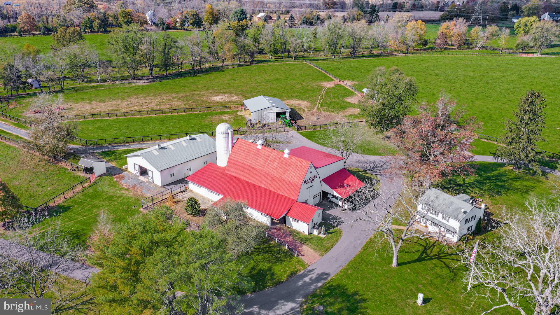 1315 Pineville Road New Hope, PA 18938 - Photo 46 of 51 an aerial view of a house with a garden and lake view
