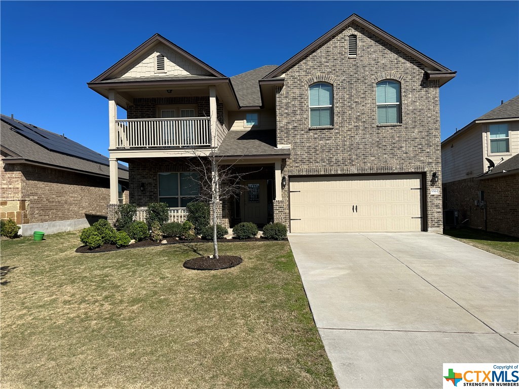 a front view of a house with sitting space