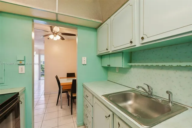 a kitchen with a sink and cabinets