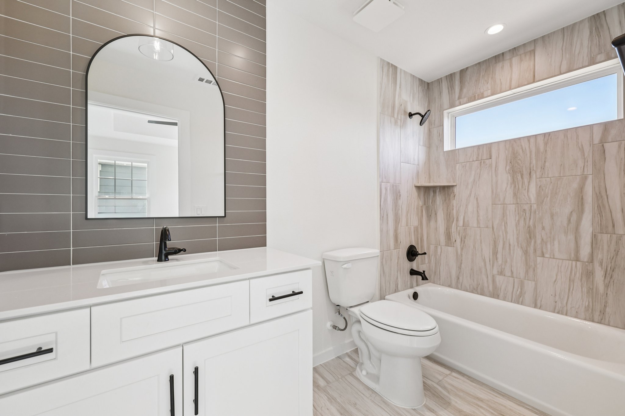 2414 Drew Lane, Unit 3 Austin, TX 78748 - Photo 12 of 18 Full bathroom with washtub / shower combination and vanity