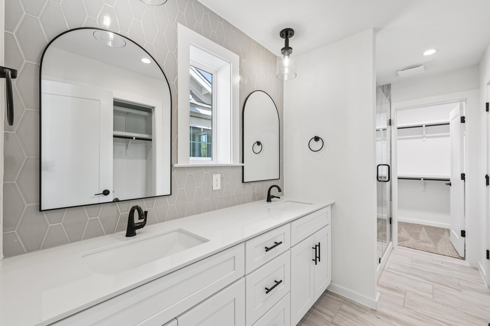 2414 Drew Lane, Unit 3 Austin, TX 78748 - Photo 15 of 18 Bathroom featuring a walk in closet, double vanity, recessed lighting, a shower stall, and tasteful backsplash