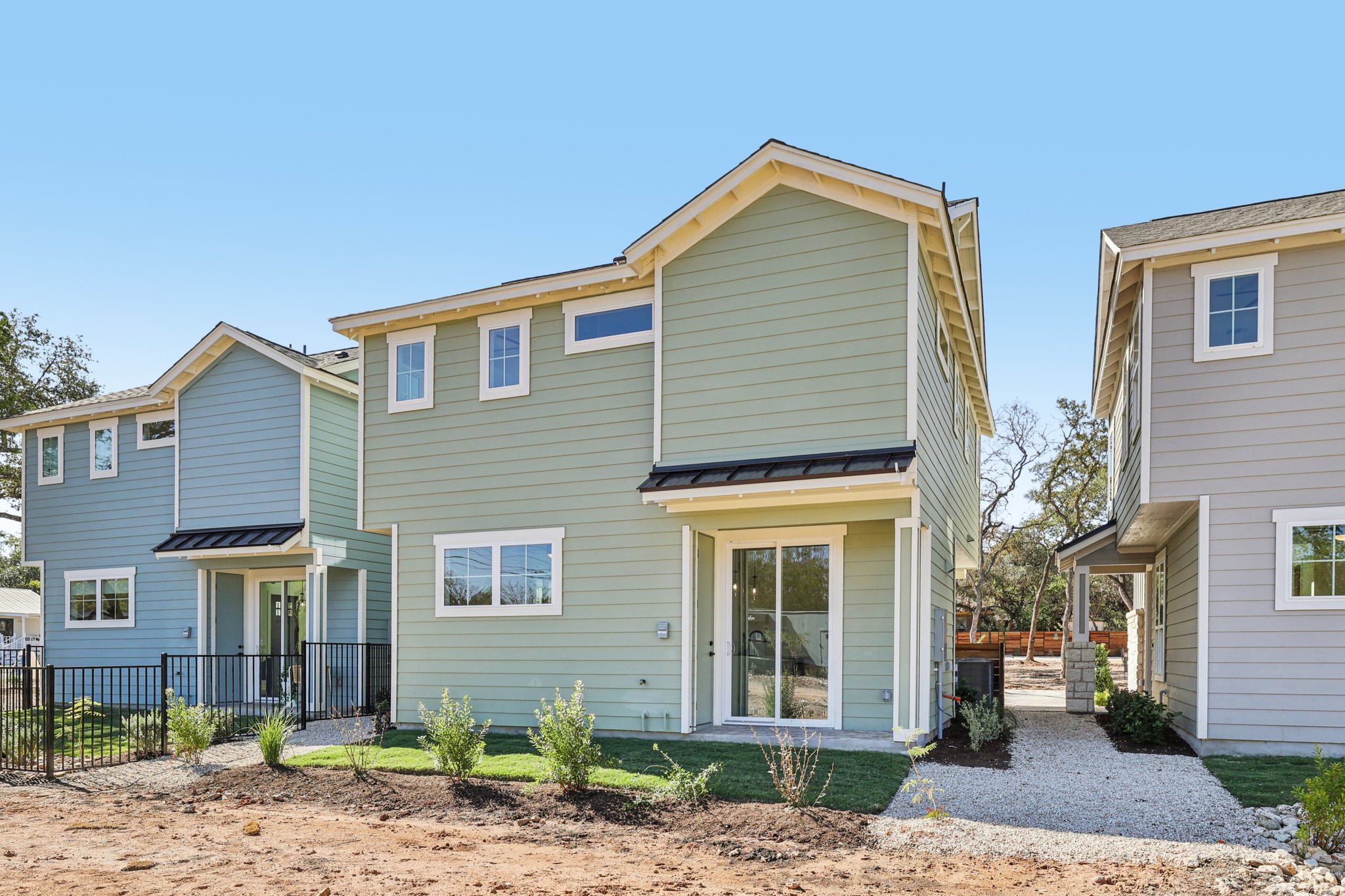 2414 Drew Lane, Unit 3 Austin, TX 78748 - Photo 17 of 18 Rear view of house with a standing seam roof