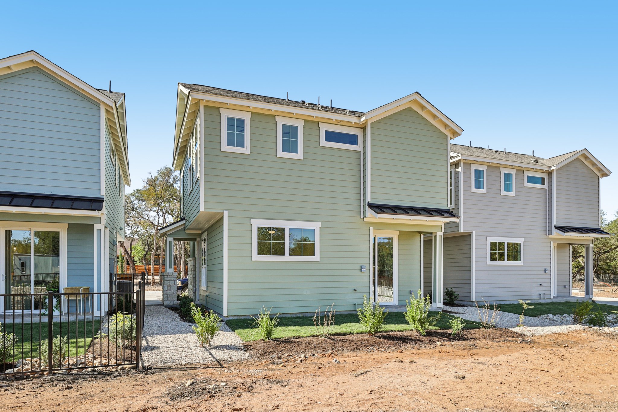 2414 Drew Lane, Unit 3 Austin, TX 78748 - Photo 18 of 18 Back of property with a gate and a standing seam roof