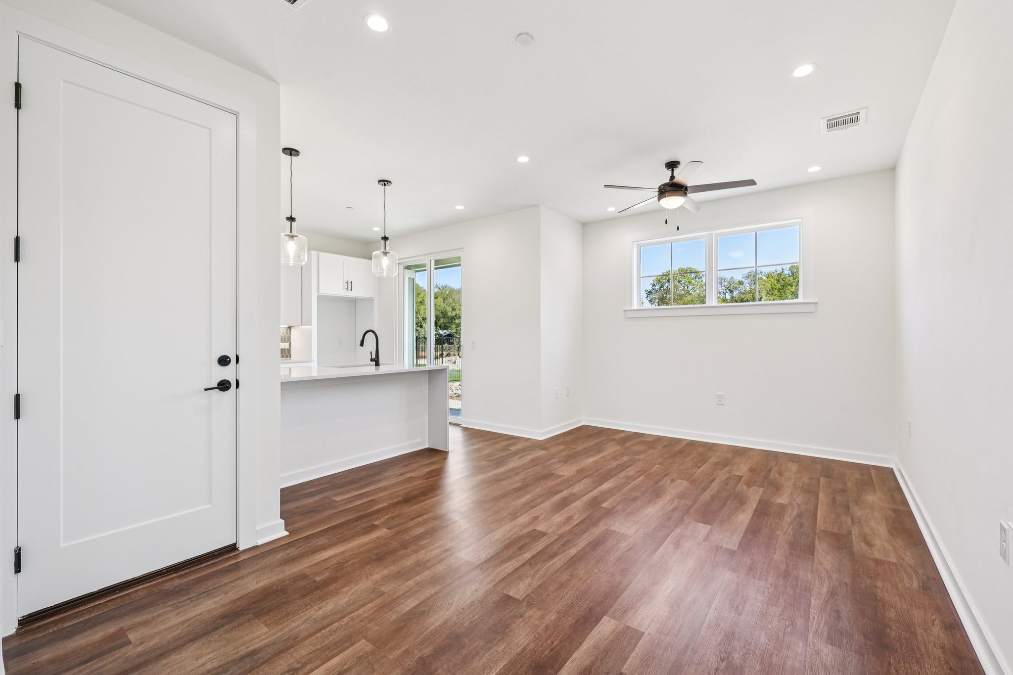 2414 Drew Lane, Unit 3 Austin, TX 78748 - Photo 5 of 18 Unfurnished living room with dark wood-style flooring, plenty of natural light, recessed lighting, and a ceiling fan