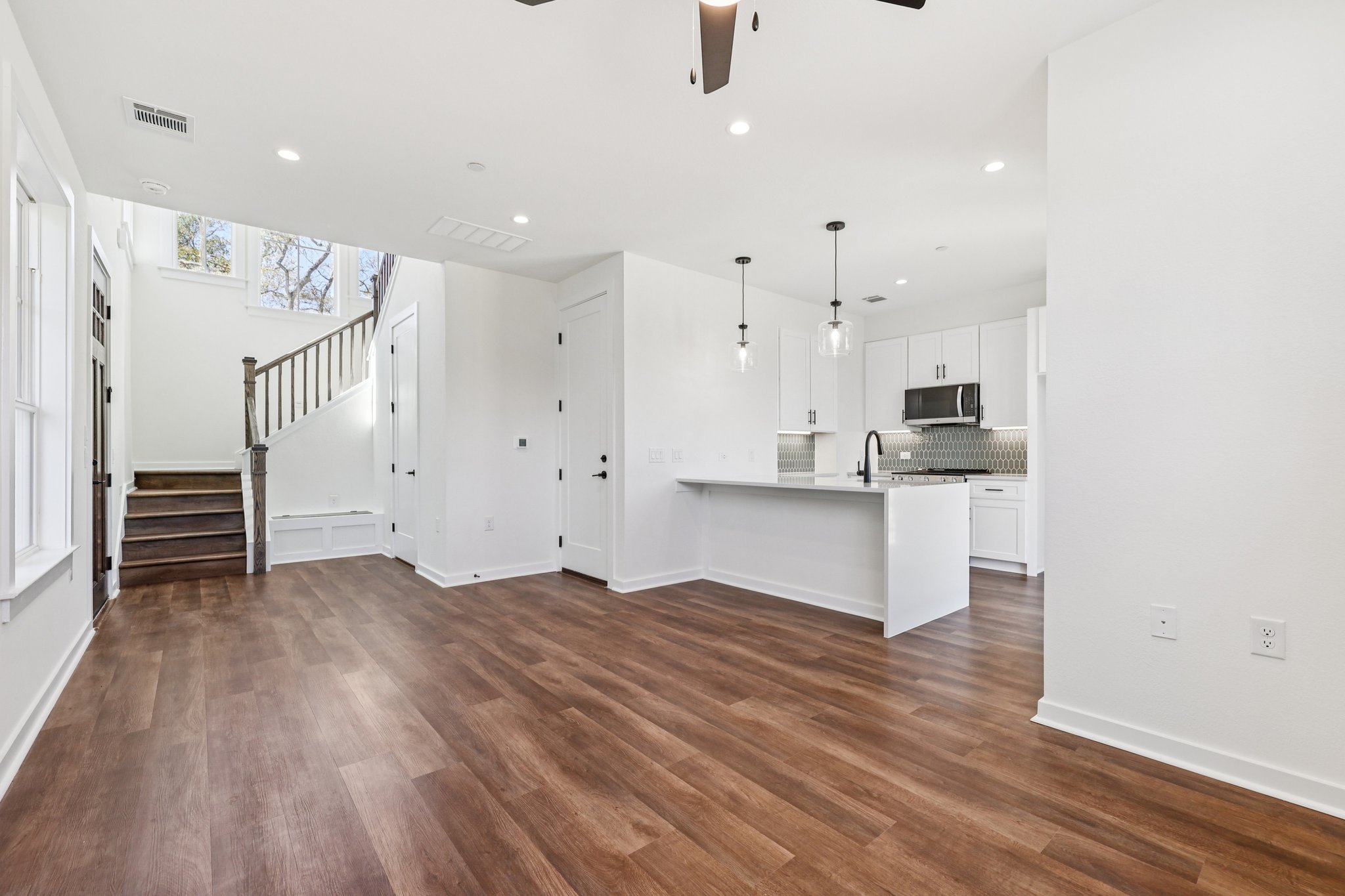 2414 Drew Lane, Unit 3 Austin, TX 78748 - Photo 6 of 18 Unfurnished living room featuring a ceiling fan, recessed lighting, and dark wood finished floors