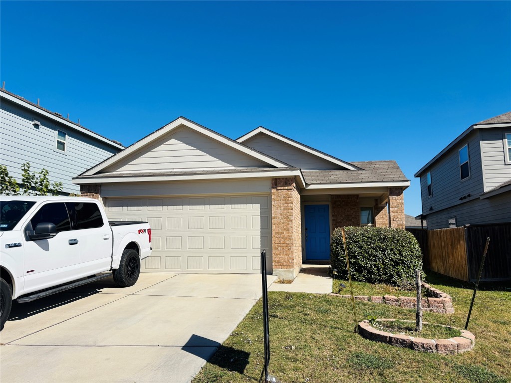 113 Star Pass Jarrell, TX 76537 - Photo 1 of 18 a front view of a house with parking space