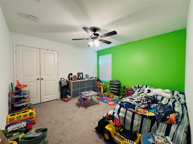 a bedroom with furniture and a chandelier