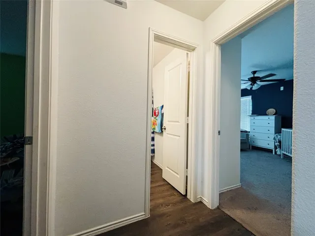 a view of a bedroom from a hallway