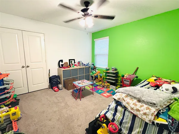 a bedroom with furniture and a bed