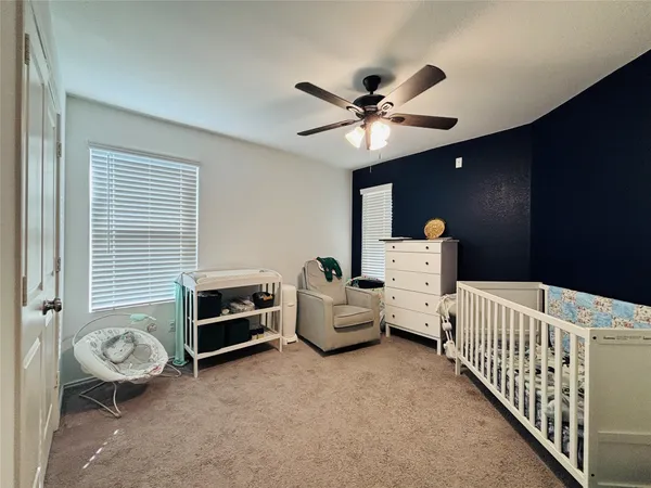 a bedroom with furniture and a chandelier