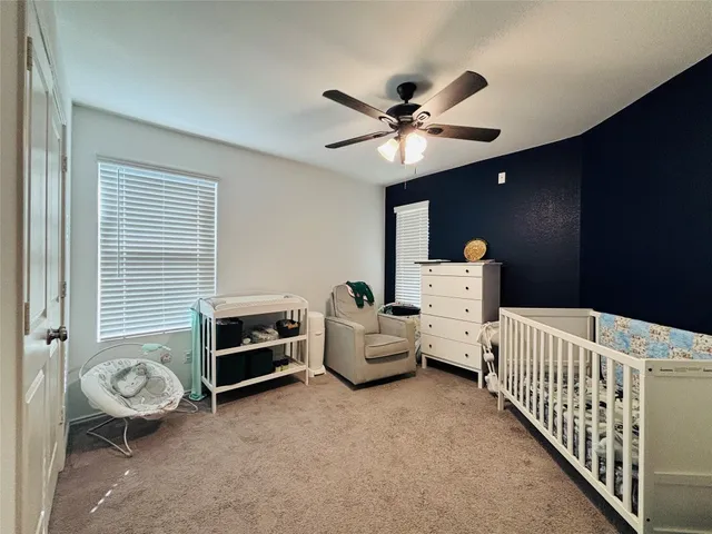 a bedroom with furniture and a chandelier