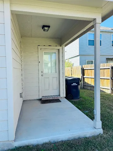 a view of an entrance to house and yard