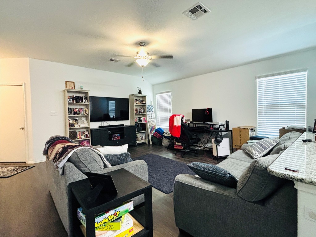 113 Star Pass Jarrell, TX 76537 - Photo 4 of 18 a living room with furniture and a flat screen tv