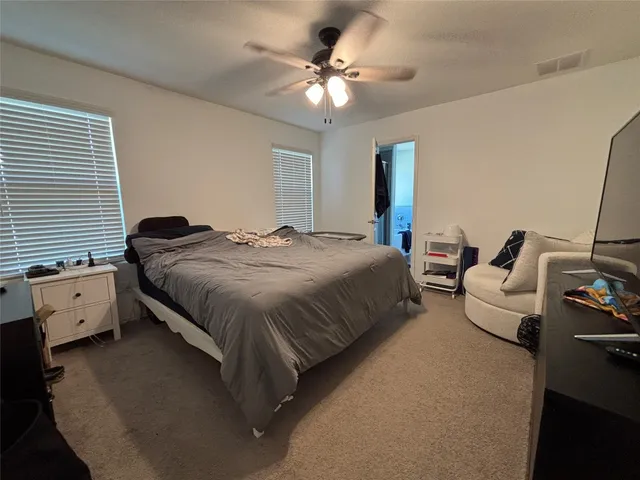 a bathroom with a toilet and a tub