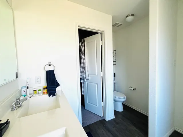 a view of a bedroom from a hallway