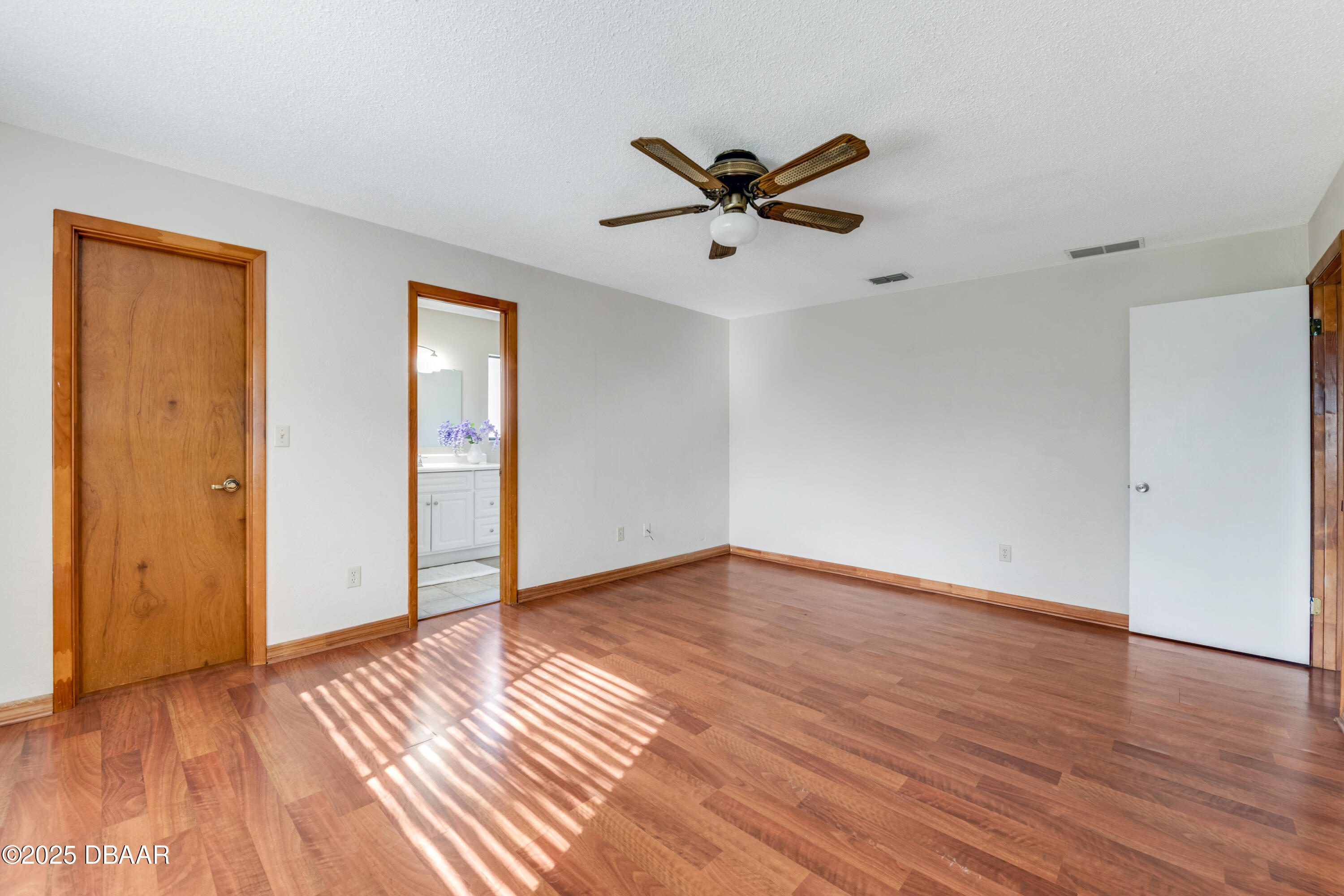 500 Sandy Oaks Boulevard Ormond Beach, FL 32174 - Photo 14 of 31 a view of an empty room and wooden floor