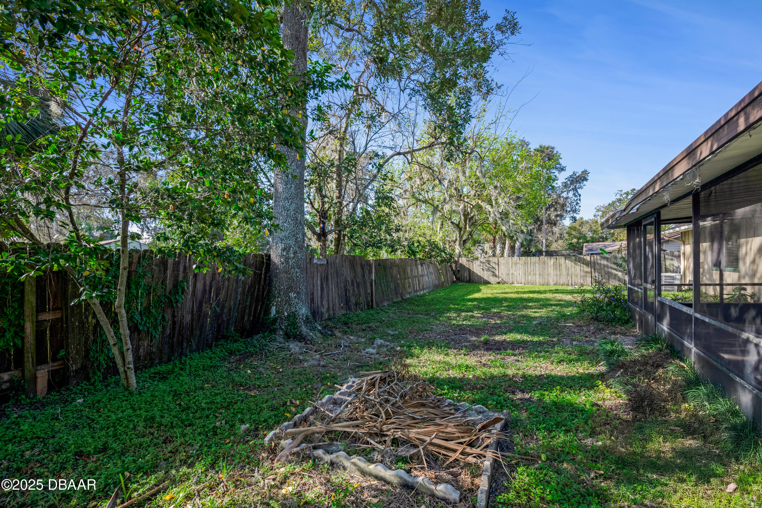 500 Sandy Oaks Boulevard Ormond Beach, FL 32174 - Photo 29 of 31 a backyard of a house with lots of green space