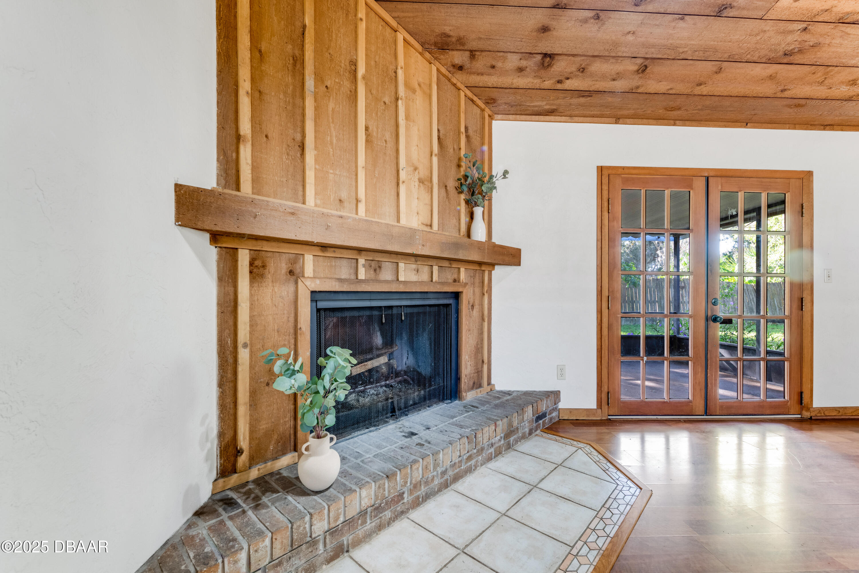 500 Sandy Oaks Boulevard Ormond Beach, FL 32174 - Photo 5 of 31 a view of an entryway with a fireplace