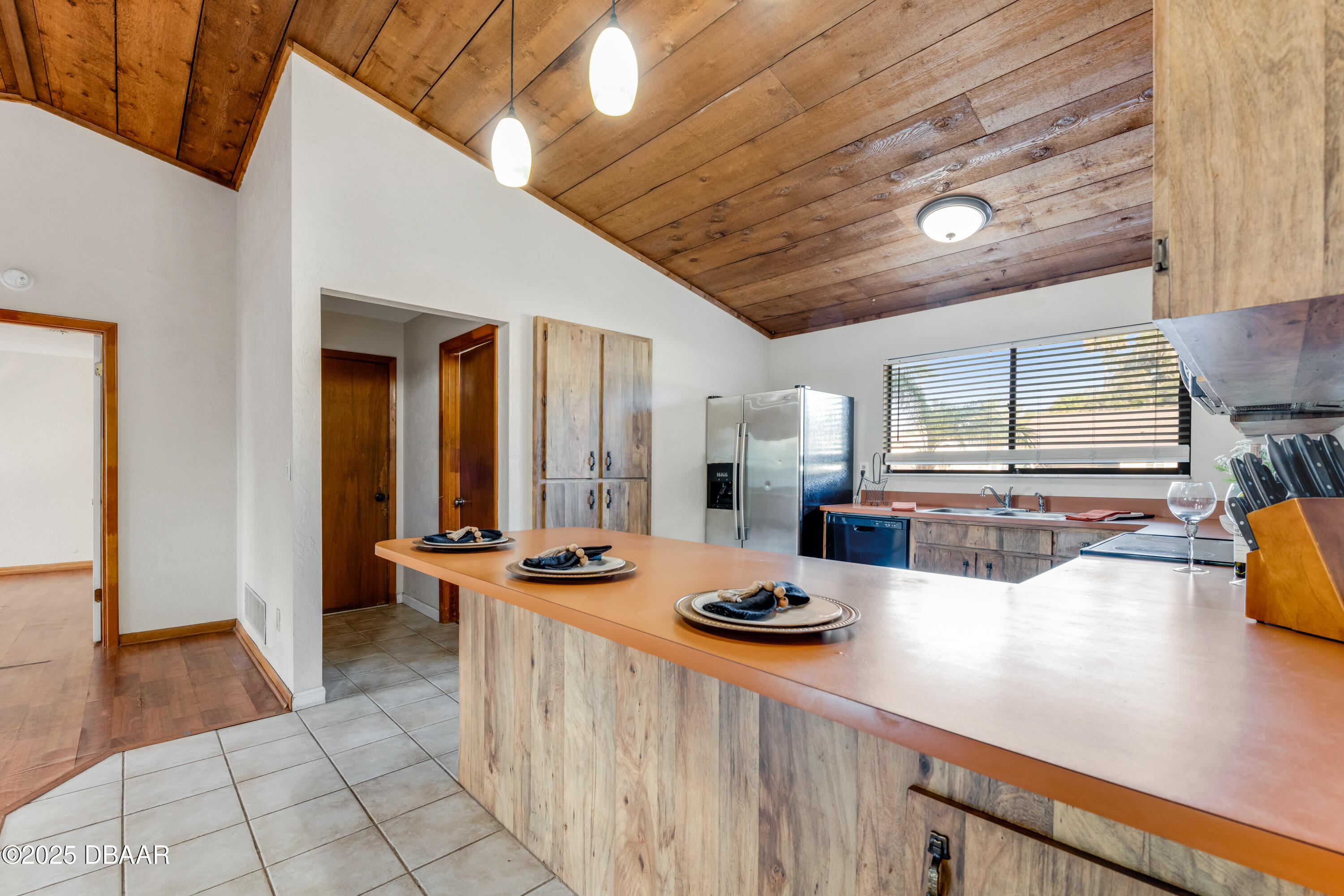 500 Sandy Oaks Boulevard Ormond Beach, FL 32174 - Photo 8 of 31 a kitchen with sink refrigerator and stove