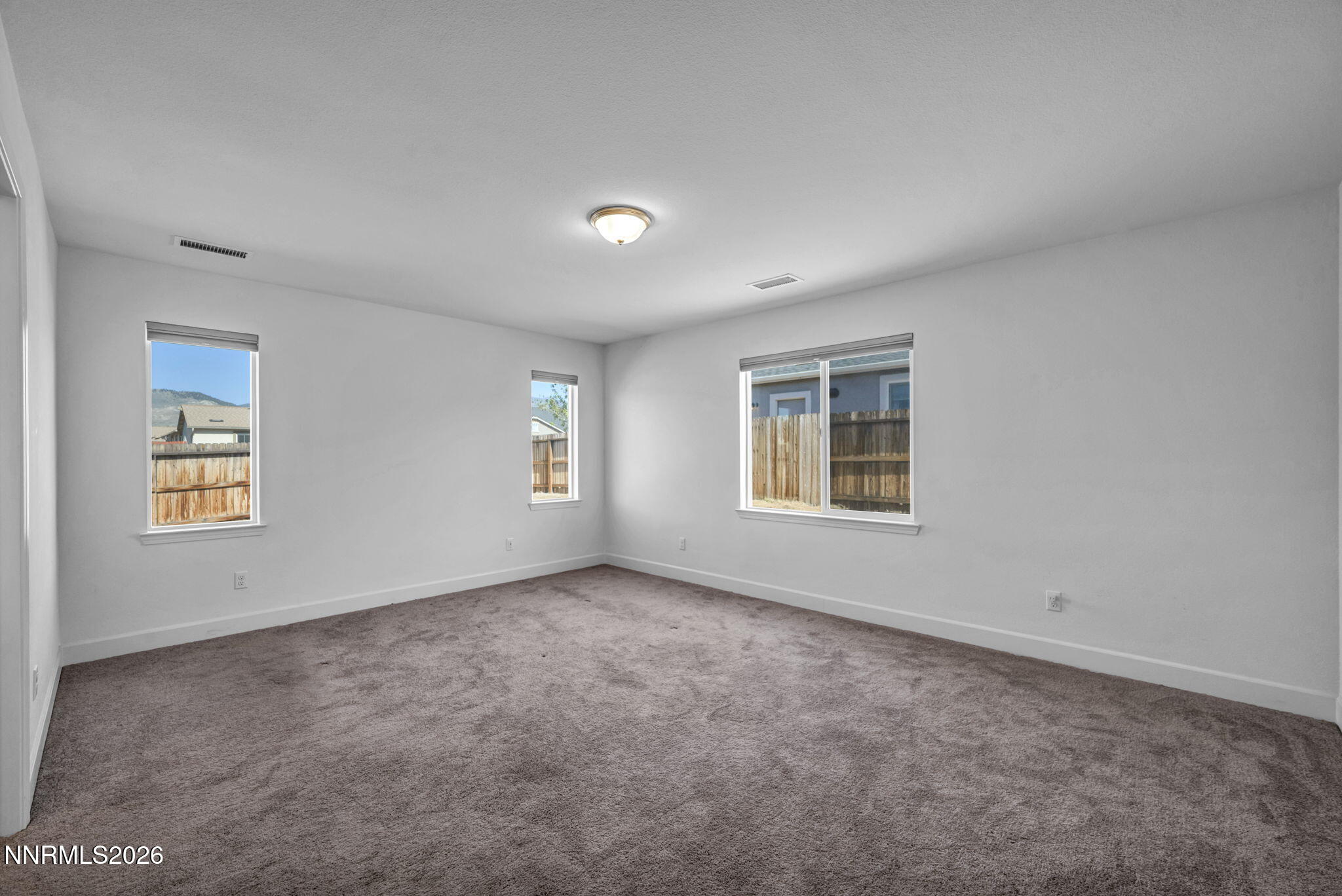 7181 Saddlehorn Road Carson City, NV 89701 - Photo 35 of 62 an empty room with windows