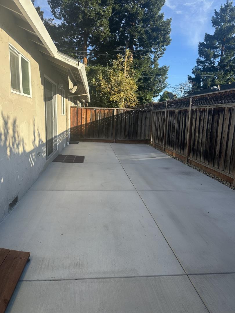 531 Piazza Drive, Unit A Mountain View, CA 94043 - Photo 14 of 15 a view of a house with backyard and a trees