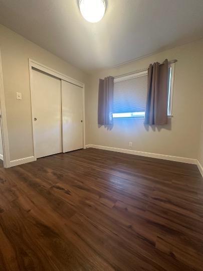 531 Piazza Drive, Unit A Mountain View, CA 94043 - Photo 10 of 15 a view of an empty room with wooden floor and a window