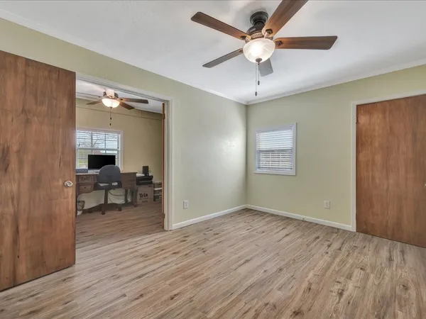a view of livingroom with hardwood floor and ceiling fan