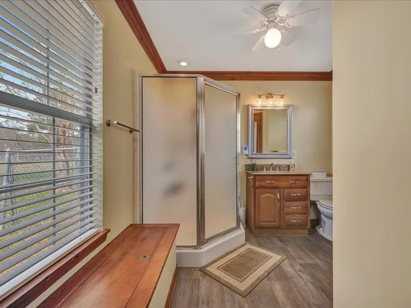 a view of a hallway and a livingroom with furniture