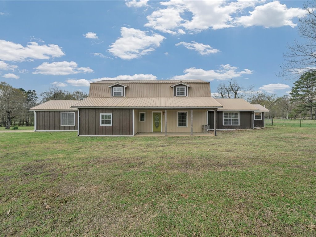 1013 Dewitt Hinson Road Pollok, TX 75969 - Photo 2 of 33 a front view of a house with a garden