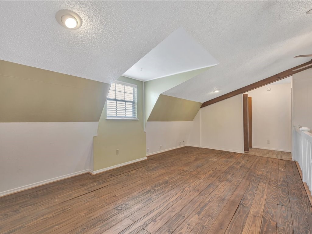 1013 Dewitt Hinson Road Pollok, TX 75969 - Photo 21 of 33 an empty room with wooden floor and windows