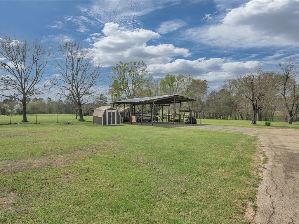 1013 Dewitt Hinson Road Pollok, TX 75969 - Photo 29 of 33 a view of house with outdoor space and garden