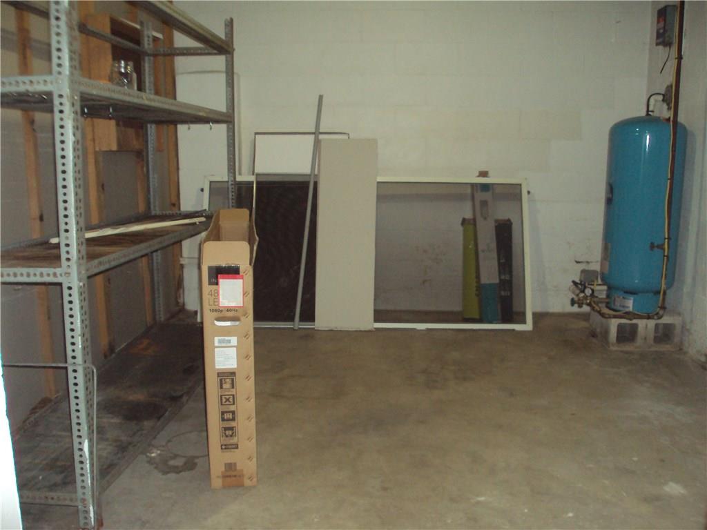 8307 Lamor Road Mercer, PA 16137 - Photo 16 of 17 Separate room in basement for storage (water treatment is disconnected as the home is now connected to public water)
