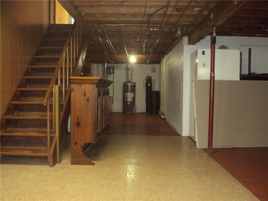 8307 Lamor Road Mercer, PA 16137 - Photo 17 of 17 view of one side of the basement from laundry area, workbench is to the right.