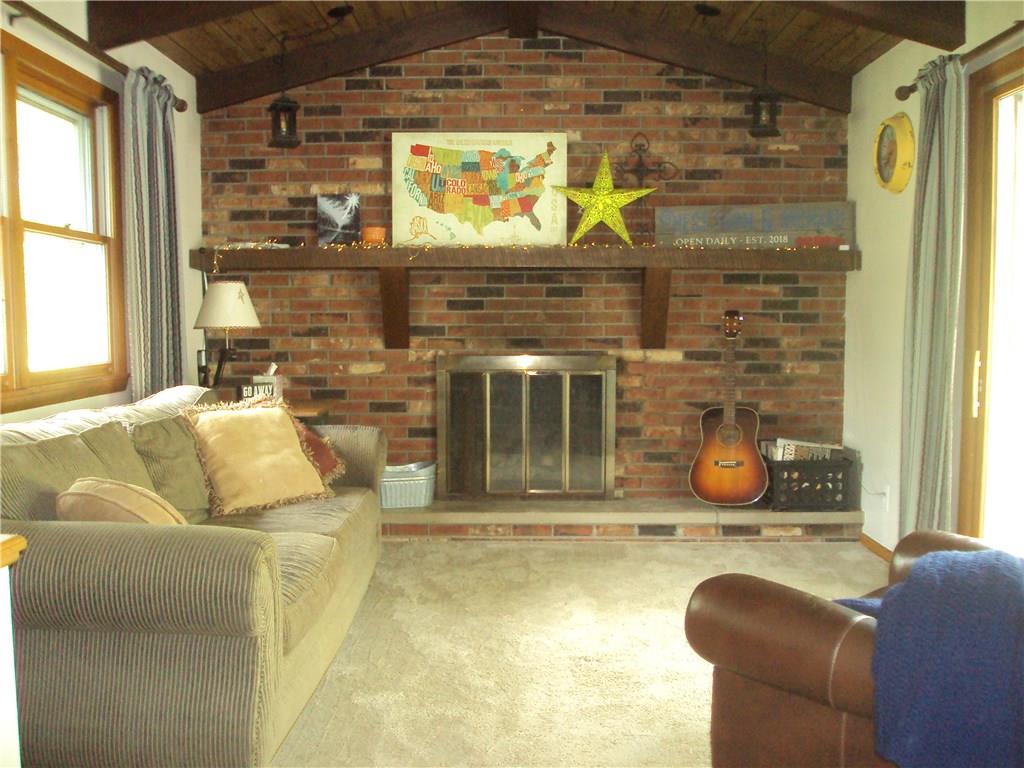 8307 Lamor Road Mercer, PA 16137 - Photo 6 of 17 Family room with gas fireplace and sliding door out to patio
