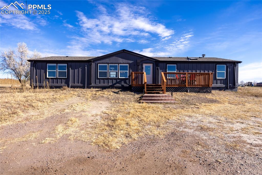 5865 East Blaney Road Peyton, CO 80831 - Photo 1 of 49 a view of a house with a yard