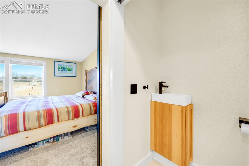 5865 East Blaney Road Peyton, CO 80831 - Photo 23 of 49 a bedroom with a bed and window