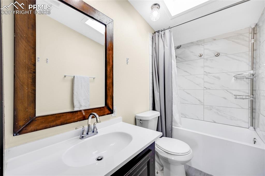 5865 East Blaney Road Peyton, CO 80831 - Photo 29 of 49 a bathroom with a sink toilet and shower