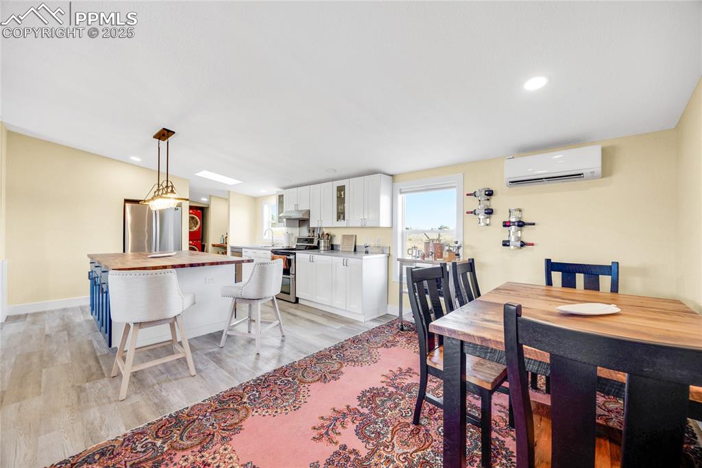 5865 East Blaney Road Peyton, CO 80831 - Photo 4 of 49 a view of a dining room with furniture