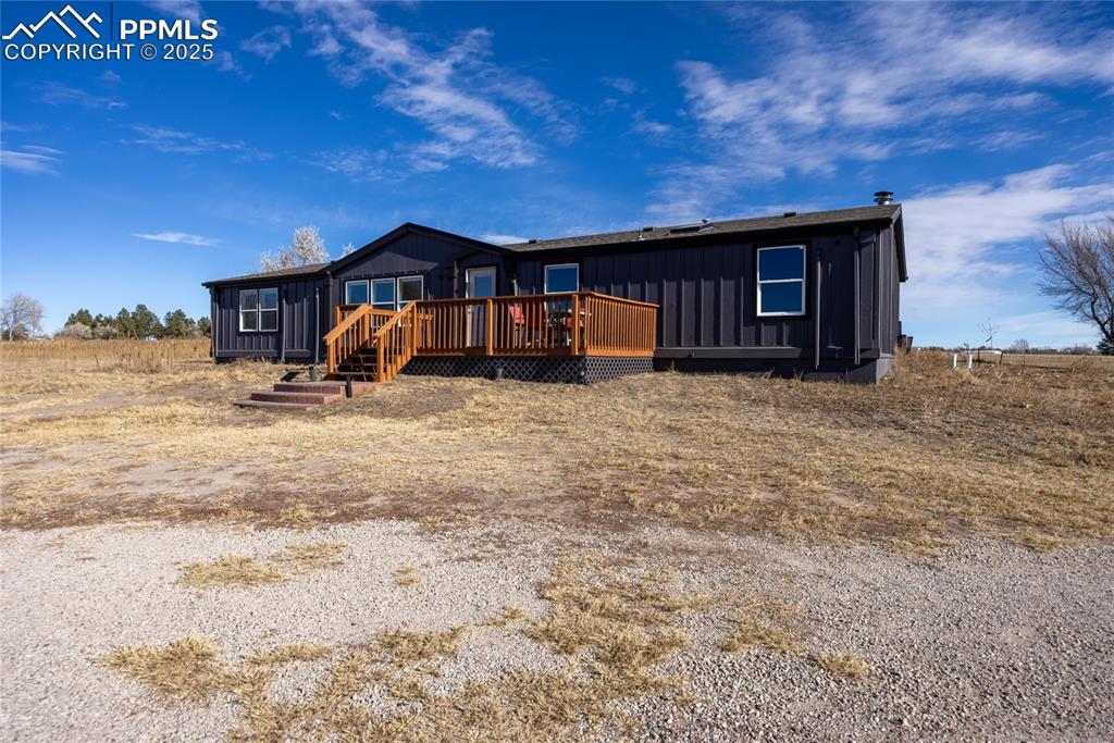 5865 East Blaney Road Peyton, CO 80831 - Photo 49 of 49 a view of a house with a yard