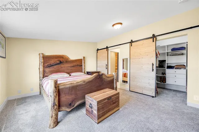 a bedroom with a bed and a cabinets