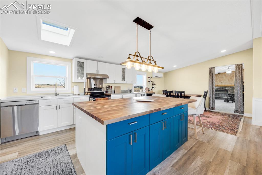 5865 East Blaney Road Peyton, CO 80831 - Photo 10 of 49 a kitchen with stainless steel appliances granite countertop a sink stove and refrigerator