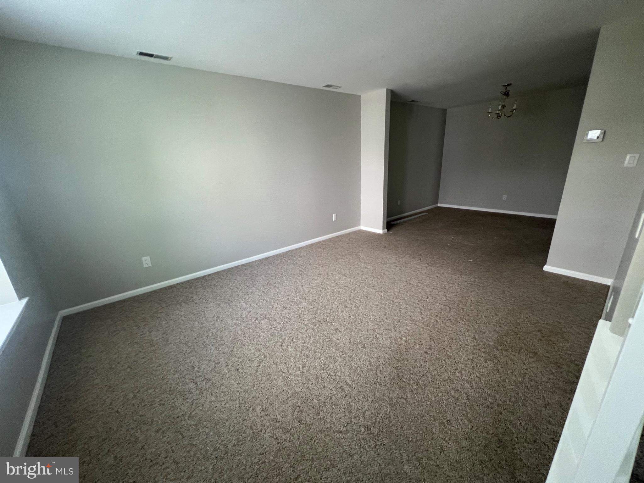2003 Stokes Road Mount Laurel, NJ 08054 - Photo 2 of 7 an empty room with a natural light