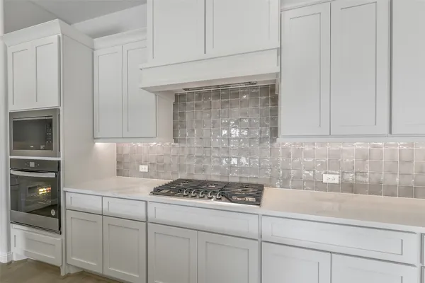 a white bath tub sitting next to a shower