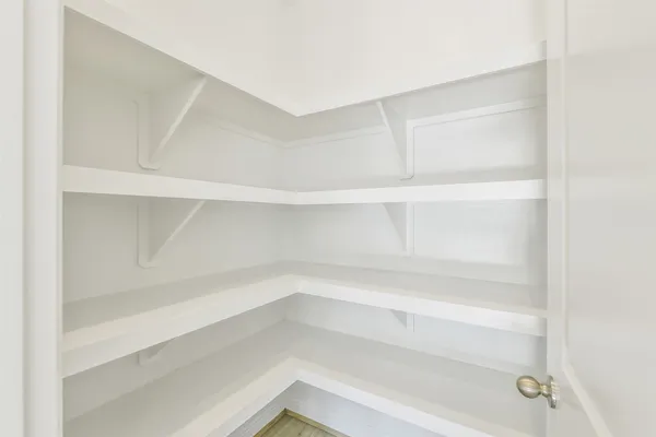 an empty room with a empty space and window