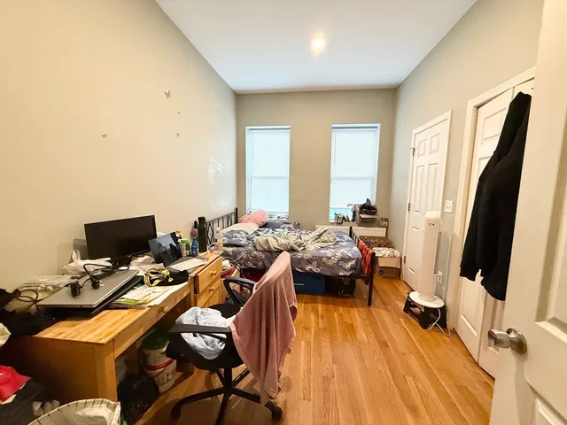 a view of a workspace with furniture and a flat screen tv