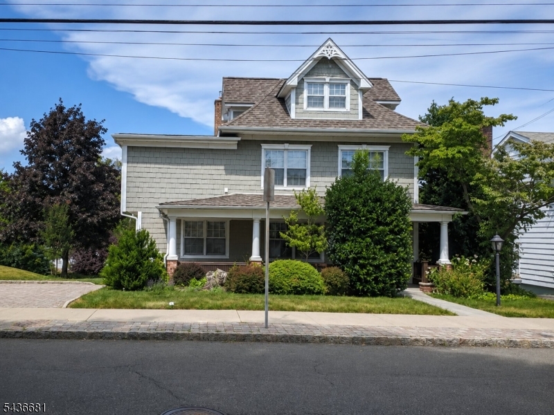 178 East Lindsley Road, Unit 2 Cedar Grove, NJ 07009 - Photo 1 of 28 a front view of a house with a garden and plants