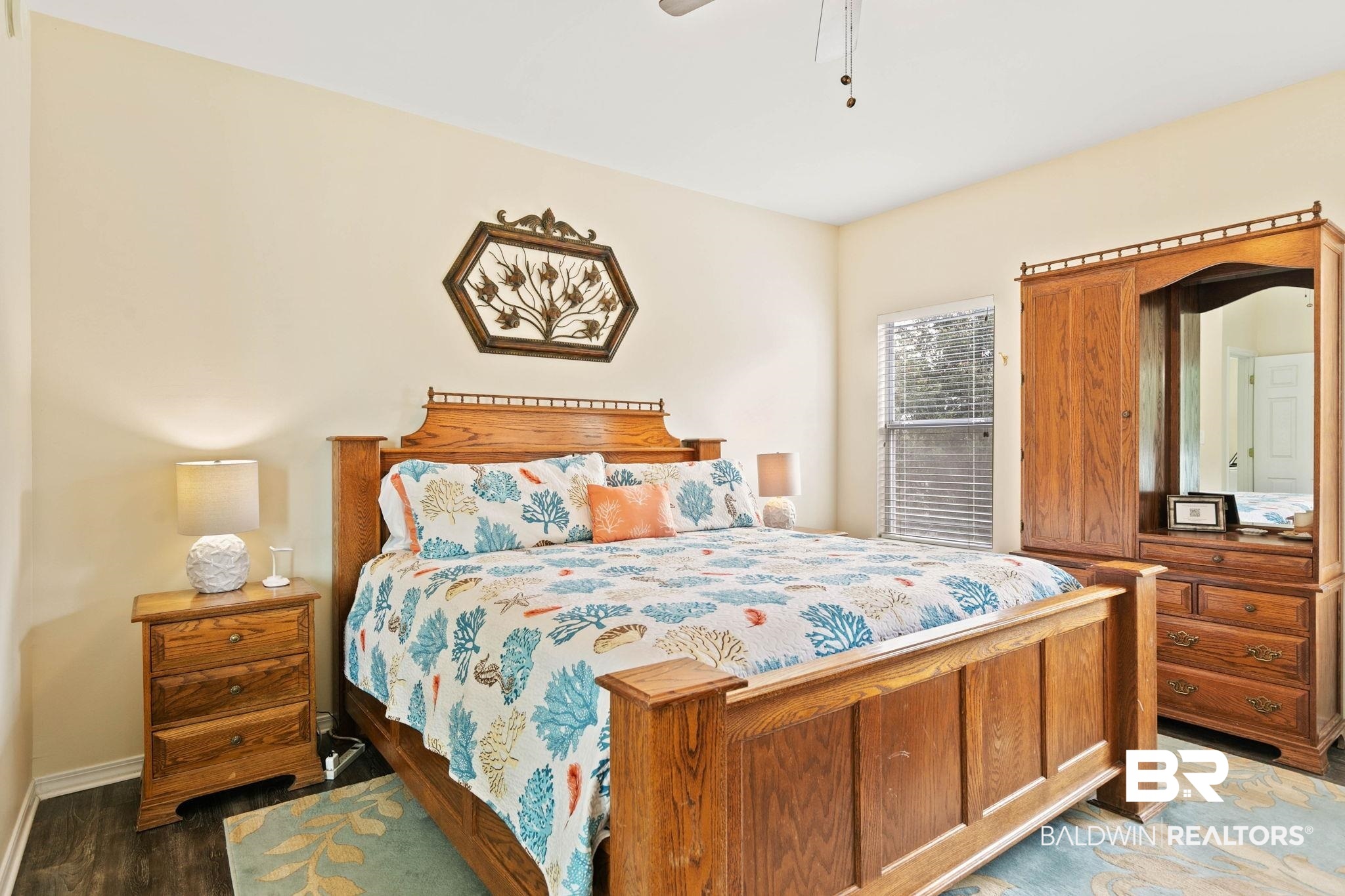6802 Shore Drive Elberta, AL 36530 - Photo 17 of 34 Bedroom featuring light-colored walls and dark wood-finish flooring