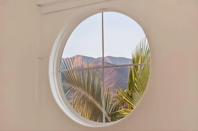 a view of staircase with a glass door