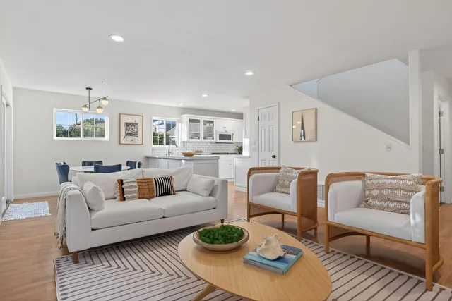 a living room with furniture and a rug