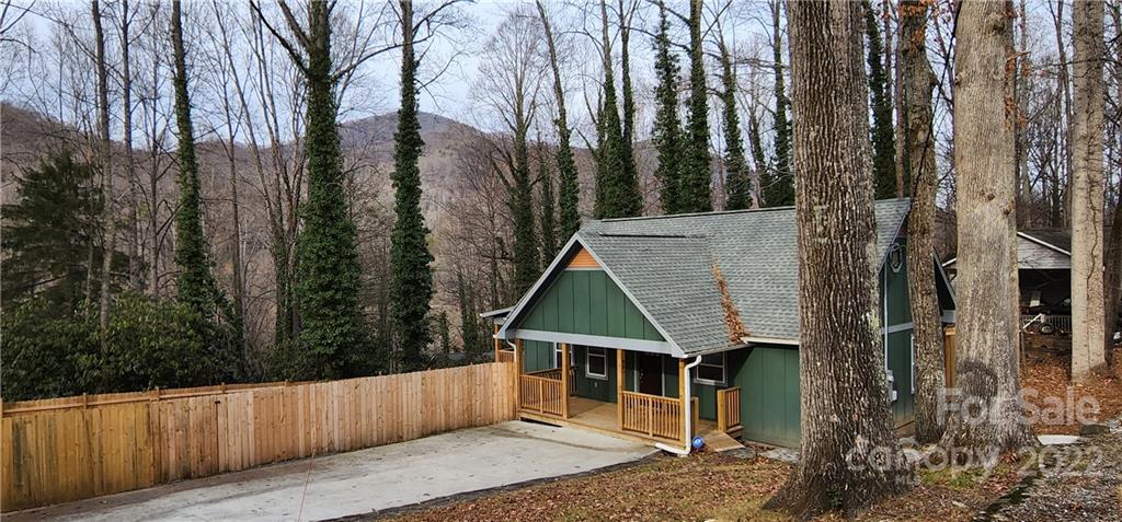 90 Ash Drive Maggie Valley, NC 28751 - Photo 13 of 27 a house with trees in front of it